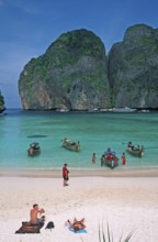 People, longtail boats on Maya Bay beach, known from the movie The Beach, one year in front of the