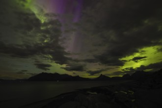 The Vestfjord in Nordland, Norway, has an enchanting atmosphere at night. Dark clouds and vivid