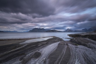 The Vestfjord in Nordland, Norway, offers a dramatic atmosphere near Bodø. Dark clouds are
