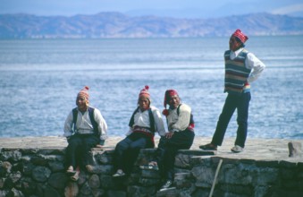 Men wearing traditional clothing on Isla Taquile in Lake Titicaca, Andean Highlands, Peru, South