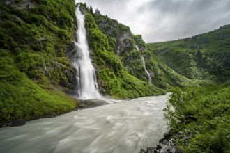 Horsetail Falls waterfall on the Lowe River in a green gorge, long exposure, Keystone Canyon,