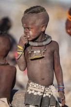 Portrait, young Himba child, traditional Himba village, Kaokoveld, Kunene, Namibia
