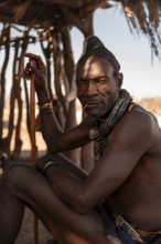 Elderly man, leader of the Himba, traditional Himba village, Kaokoveld, Kunene, Namibia