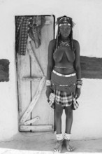 Black and white, portrait, brightly decorated woman of the Hakaona tribe, also Havakona or