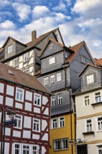 Historic half-timbered houses under a slightly cloudy sky, The historic city center of Marburg in