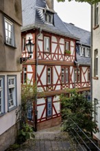 Idyllic half-timbered houses in a narrow alley with a nostalgic atmosphere, The historic old town