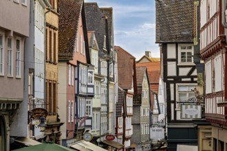 Picturesque street scene of an old town with closely adjacent half-timbered houses, The historic