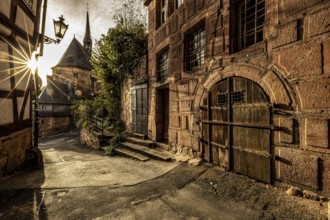 Historic alley with old charm and sunshine through the old town, The historic alleys and streets of