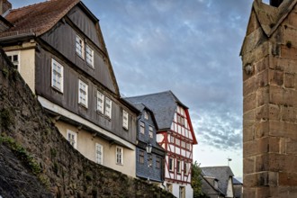 Half-timbered houses and city walls in a cozy evening mood, The historic city center of Marburg in
