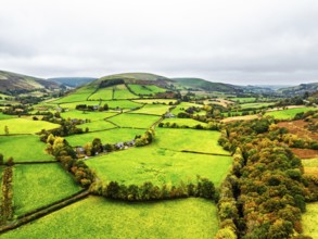 Autumn colours of Farms over River Wye and Road A470 from a drone, Llanidloes, Powys,