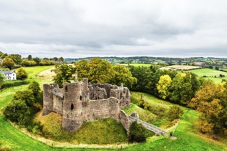 Autumn Colours over ruins of Grosmont Castle from a drone, Grosmont, Monmouthshire, Wales, UK