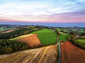Sunset of Devon Farms and Fields over Berry Pomeroy from a drone, Totnes, England, United Kingdom