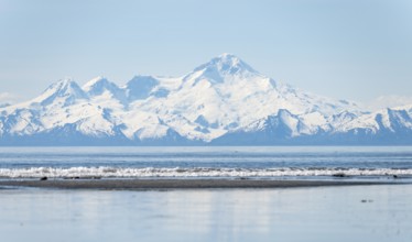 Beach at Anchor Point, Cook Inlet, glaciated mountain peaks of the Aleutian Range with Mount