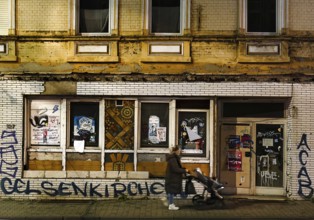 Decaying façade covered with graffiti, no-go area in Gelsenkirchen, one of the poorest cities in