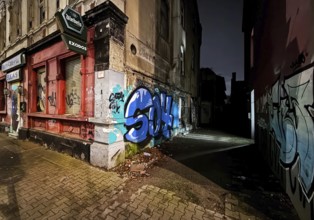 Decaying façade smeared with graffiti, scrap property in a no-go area, Gelsenkirchen, Ruhr area,