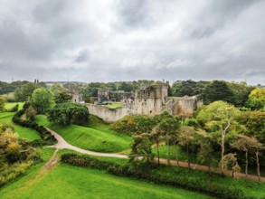 Autumn Colours over ruins of Caldicot Castle from a drone, Caldicot, Monmouthshire, Wales, UK