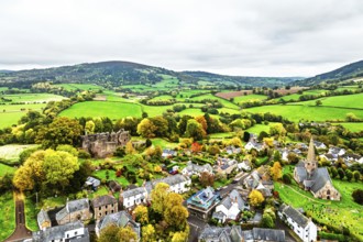 Autumn Colours over ruins of Grosmont Castle from a drone, Grosmont, Monmouthshire, Wales, UK