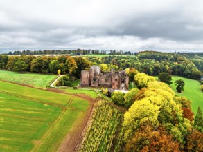 Autumn Colours over ruins of Goodrich Castle and River Wye from a drone, Goodrich, Herefordshire,