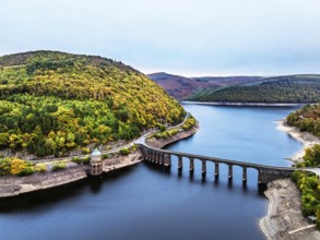 Autumn over Garreg Ddu Dam from a drone, Elan Valley, Caban-Coch Reservoir, Rhayader, Wales, UK