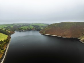 Autumn colours over Llyn Clywedog and Clywedog Reservoir from a drone, Llanidloes, Wales, UK