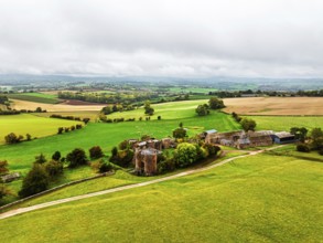Autumn Colours over ruins of Pembridge Castle or Newland Castle from a drone, Herefordshire,