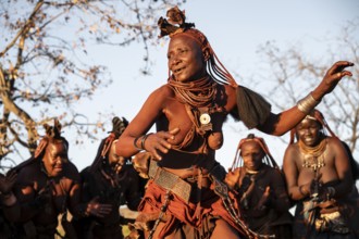 Himba woman dancing euphorically, traditional dance, traditional Himba village, Kaokoveld, Kunene,