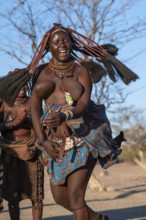 Himba woman dancing euphorically, traditional dance, traditional Himba village, Kaokoveld, Kunene,