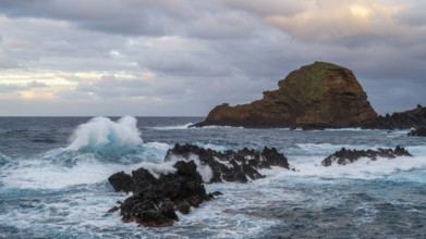 Sunset, waves and rocks, coast near Porto Moniz, Madeira, Portugal