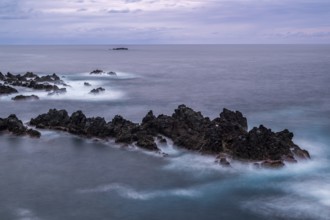 Sunset, long exposure, waves and rocks, coast near Porto Moniz, Madeira, Portugal