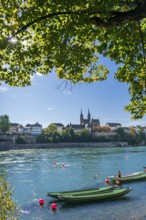 The Rhine with rowing boats in the sunshine in the late afternoon, Basel