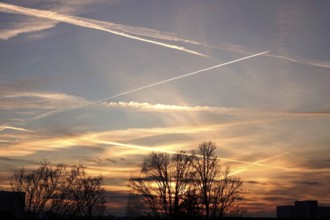 Picturesque evening sky with contrails, autumn, Germany