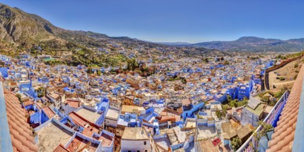 View of a city full of blue buildings with mountains in the background, Morocco, Chefchaouen,