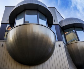 Futuristic balconies with bay windows on a prefabricated building from the sixties in