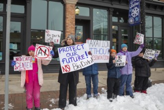 Saline, Michigan USA - 1 December 2025 - Rural Michigan residents rally against the $7 billion