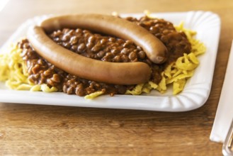 Swabian favorite dish. Lentils, spaetzle, side sausage. Stuttgart, Baden-Württemberg, Germany