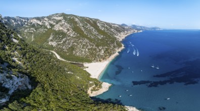 Picturesque rocky coast, cliffs and Cala Sisine beach, aerial view, Golfo di Orosei, Baunei,