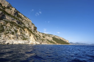 Picturesque rocky coast, cliffs in morning light, blue sea, Golfo di Orosei, Baunei, Sardinia,