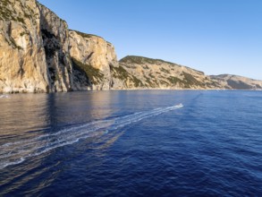 Motorboat rides on picturesque rocky coast ImmorgenLicht, cliffs, Golfo di Orosei, Baunei,