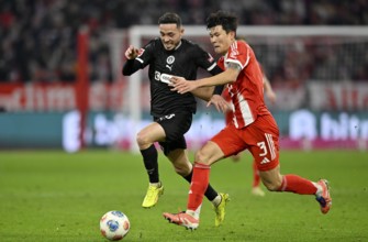Duel, action Min-jae Kim FC Bayern Munich FCB (03) against Mathias Pereira Lage FC St. Pauli (28)