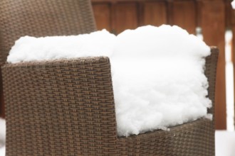 Snow-covered garden chairs, winter, Germany