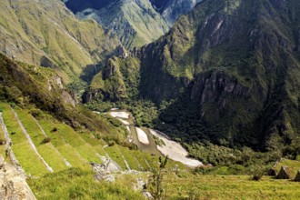 Green mountain terraces lead down into the valley, The Urubamba Valley near Machu Picchu in Peru