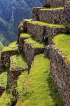 Close-up of the stone terraces of Machu Picchu stretching on the mountainside, The ruins of the