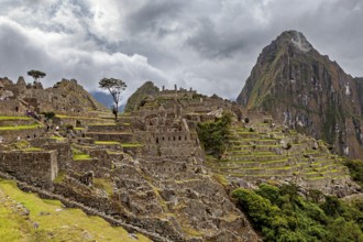 Historic ruins of Machu Picchu with impressive mountain scenery and clouds, The ruins of the Inca