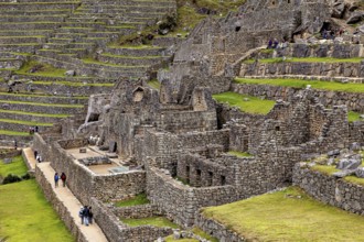 Stone walls and terraces with walking path in the Inca site of Machu Picchu, The ruins of the Inca