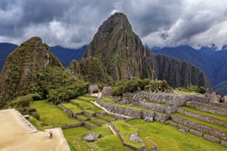 Ruins of Machu Picchu with dramatic skies and thick forests, The ruins of the Inca city of Machu