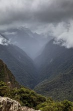 Mystical mountain landscape covered by clouds, The Urubamba Valley near Machu Picchu in Peru