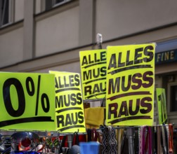 Retail trade with signs for price reductions and discounts, Potsdam, Brandenburg, Germany