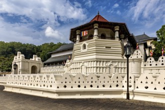 Historic red-roofed building surrounded by lush nature and peaceful atmosphere, The Temple of the