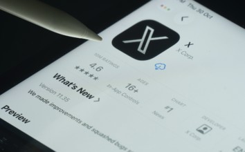 Dhaka, Bangladesh- 30 Oct 2025: X app on a iPad screen with a pen pointing at the install option