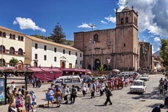 Street scene in a city with a church and people in traditional costumes, traditional parade of